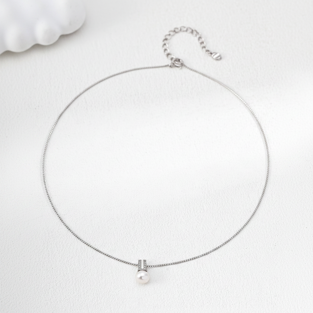 Lumière Pearl & Crystal Bar Necklace - Platinum on cream background